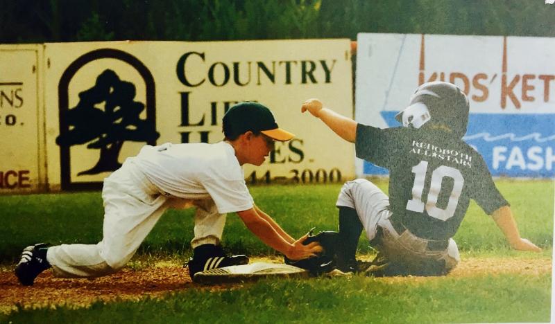 Ben Bamforth applies a tag on Zack Gelof in a 2004 Little League playoff game.